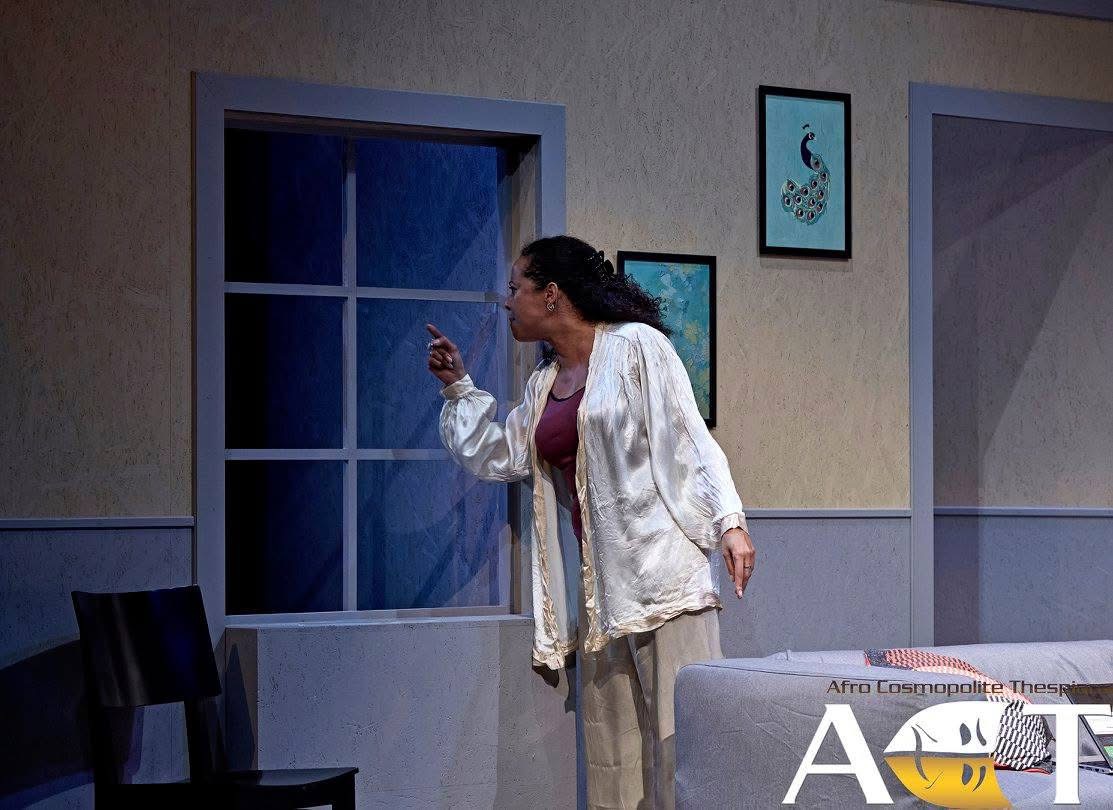 A woman alone by the window in An Enemy of the People.