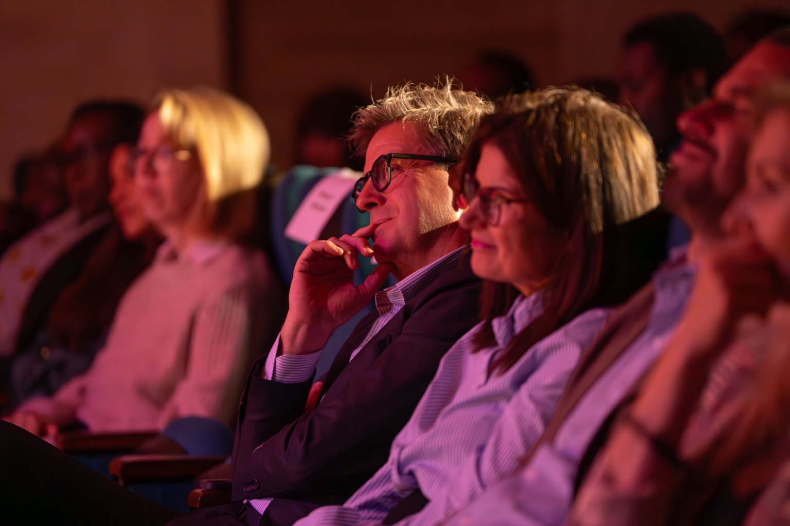 The Danish ambassador and the EU ambassador watching the play among the audience.